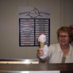 woman holding a cone of ice cream