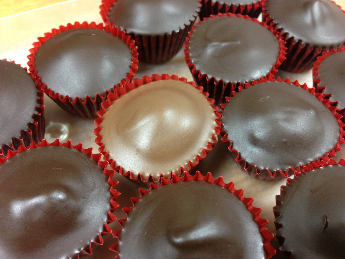 rows of peanut butter cups in red cups