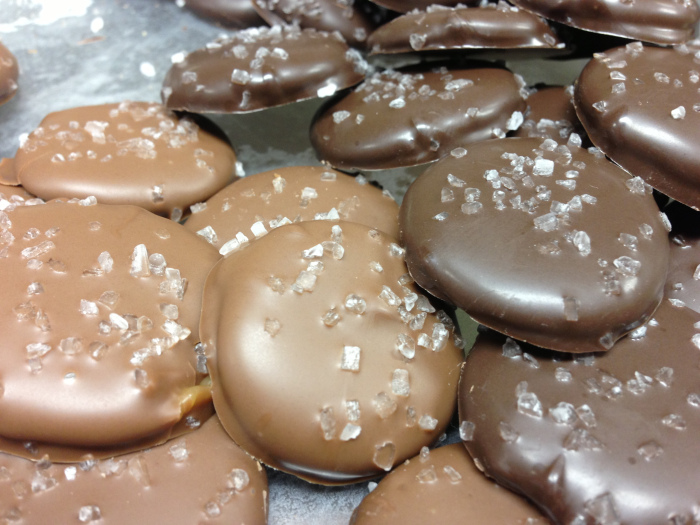 milk chocolate and dark chocolate covered caramel patties topped with sea salt