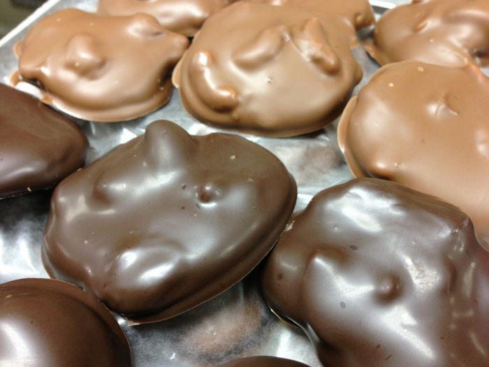 caramel patties with cashews topped with milk chocolate and dark chocolate